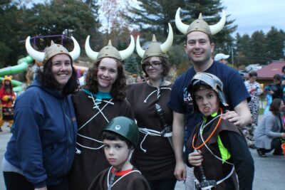 Family in Viking costumes at Halloween event.