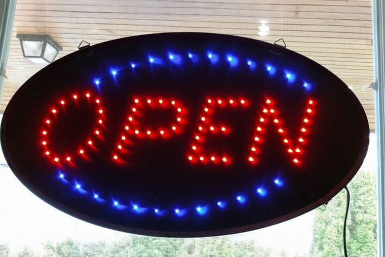 Oval LED sign with red "OPEN" text and blue border lights